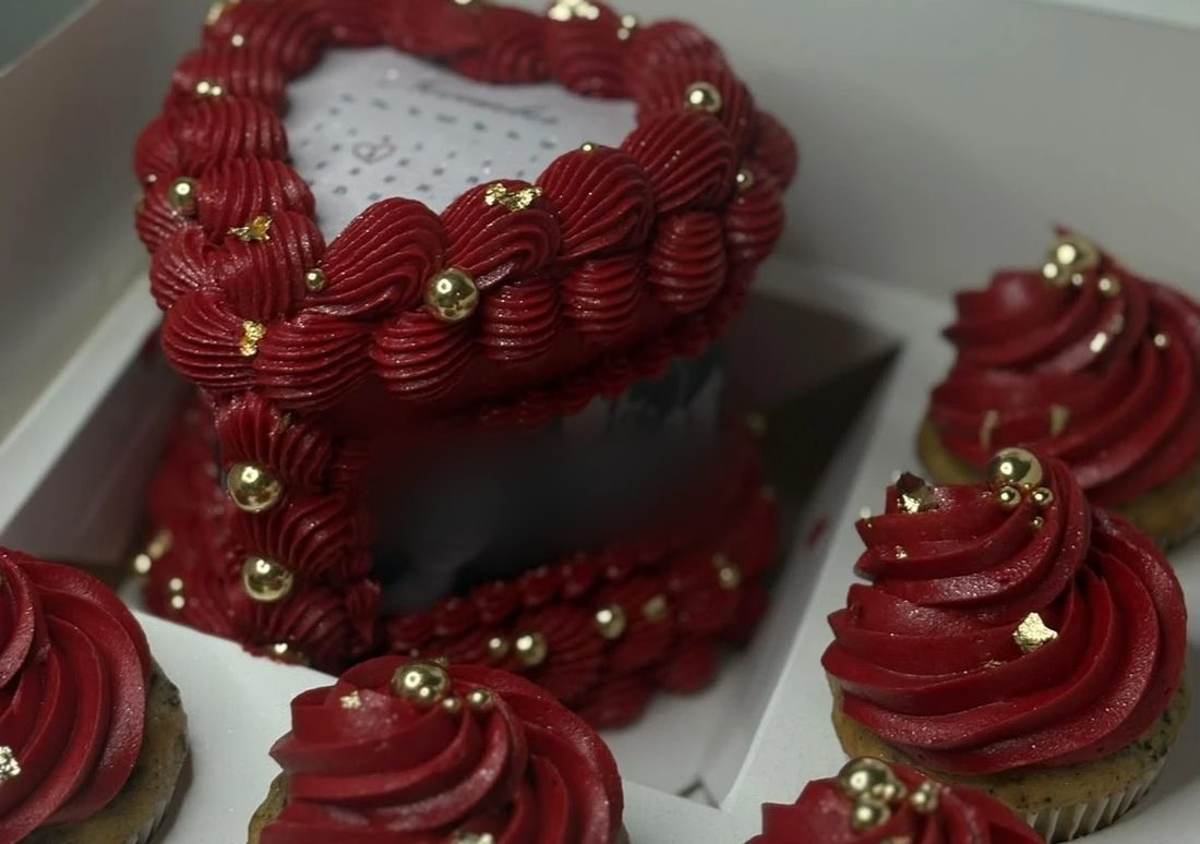 Red velvet style cupcakes and a 4 inch heart mini cake with gold accents